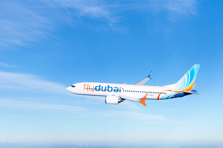 ae aero-plane flying in sky - Fly Dubai